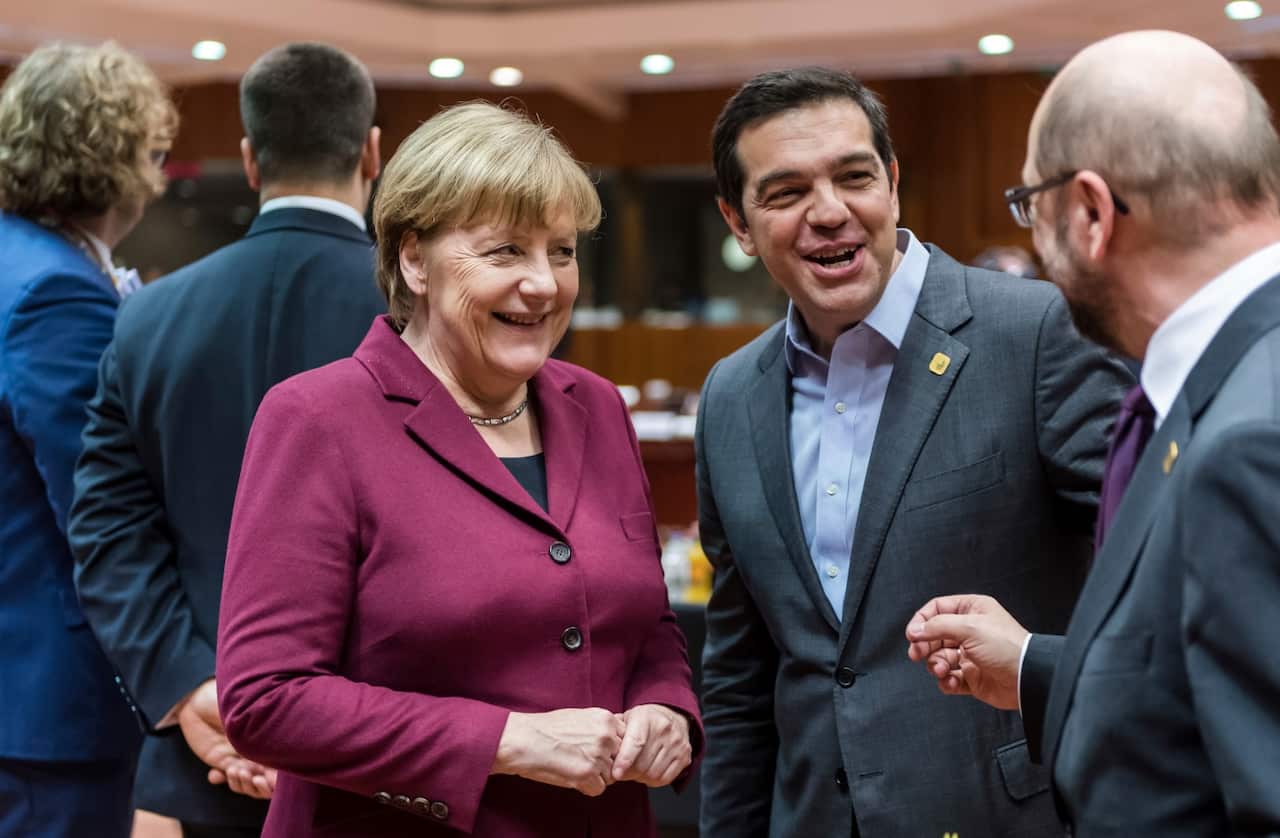 German Chancellor Angela Merkel speaks with Greek Prime Minister Alexis Tsipras, second right, and European Parliament President Martin Schulz.