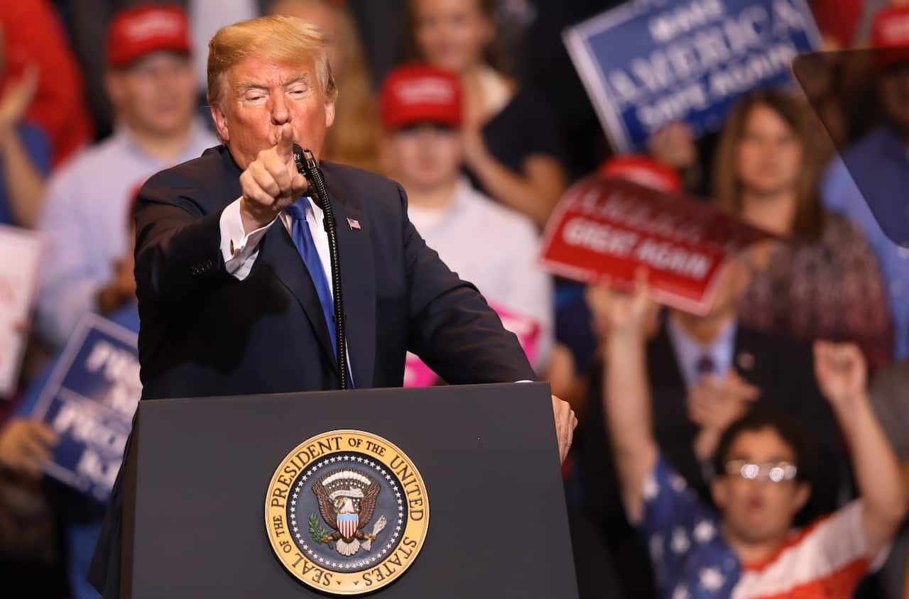 President Donald Trump waves after speaking during a rally Tuesday, Aug. 21, 2018, in Charleston, W.Va.