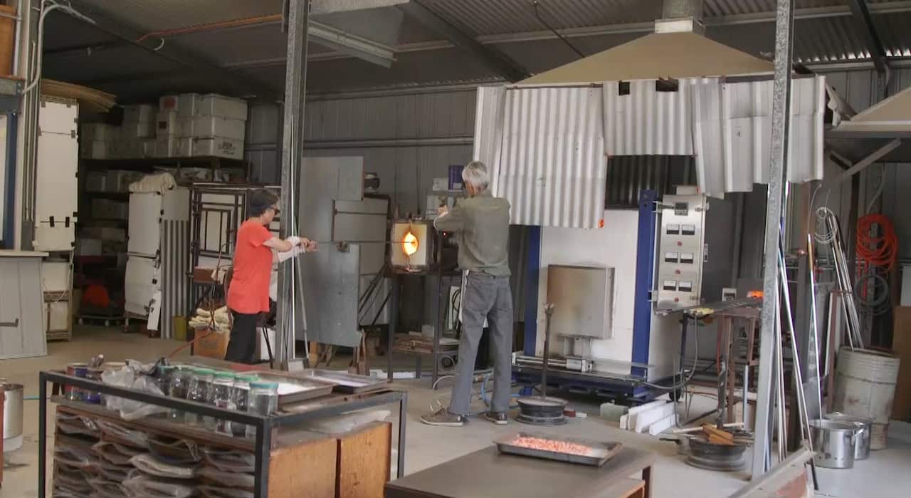 Setsuko and her husband operating one of their furnaces.