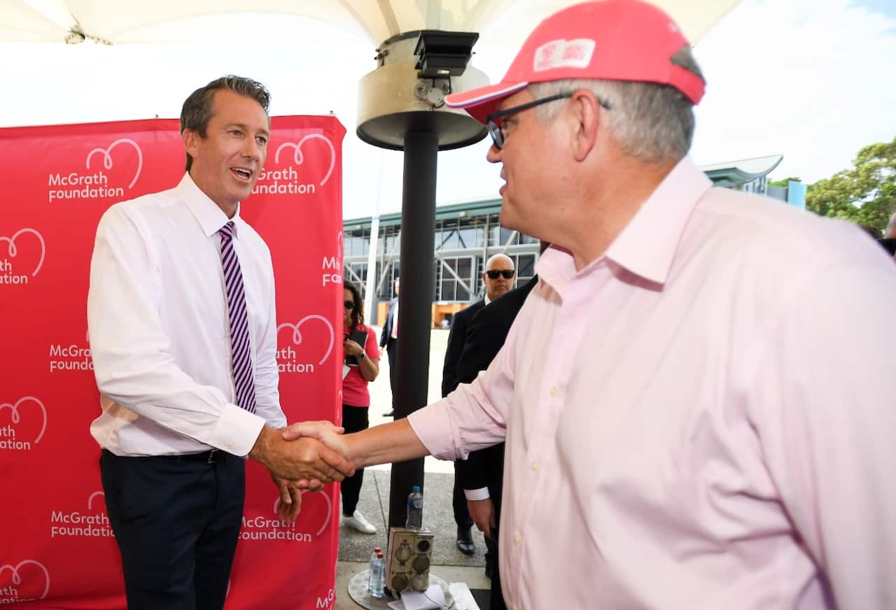 Former cricketer Glenn McGrath shakes hands with Prime Minister Scott Morrison at a luncheon for Jane McGrath Day at the SCG in Sydney, Saturday, January 5, 2019.
