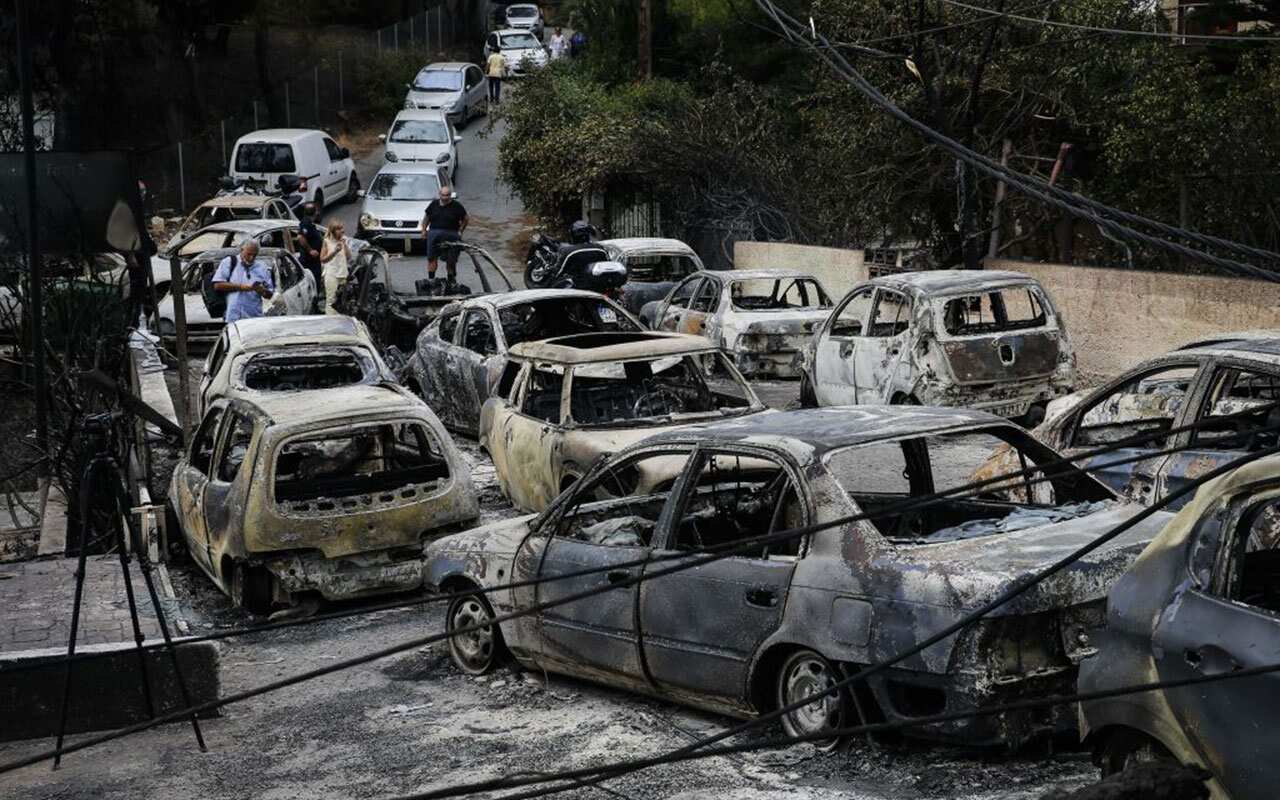 Burnt cars are seen following a wildfire at the village of Mati near Athens, Greece on July 24, 2018. 