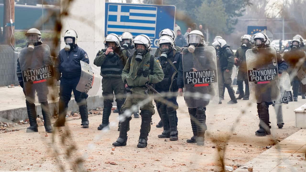 Greek riot policemen patrol the border to stop migrants and refugees from seeking entry into Europe, Edirne, Turkey.