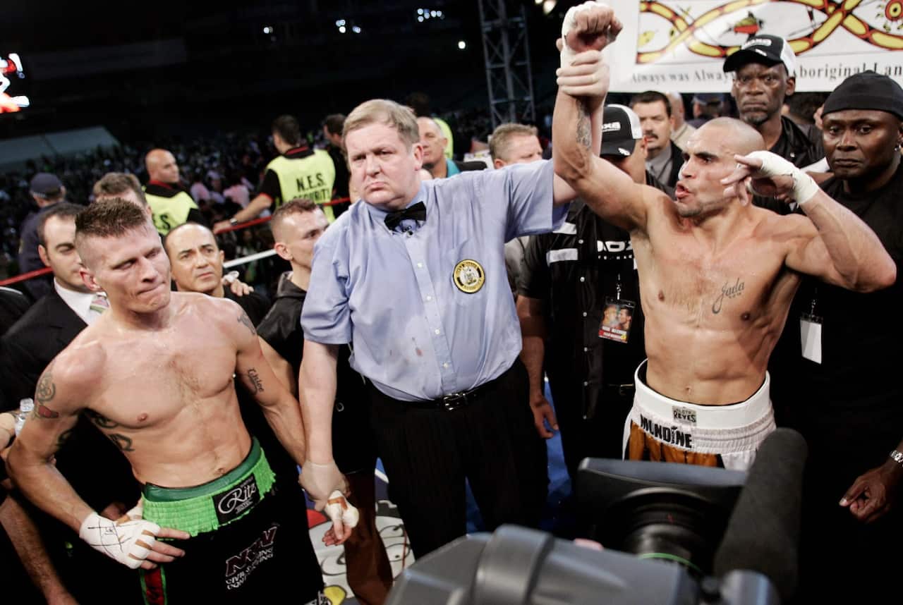 Australia's Anthony Mundine, right, reacts as he is declared the winner in his 2006 fight against Danny Green (AAP)