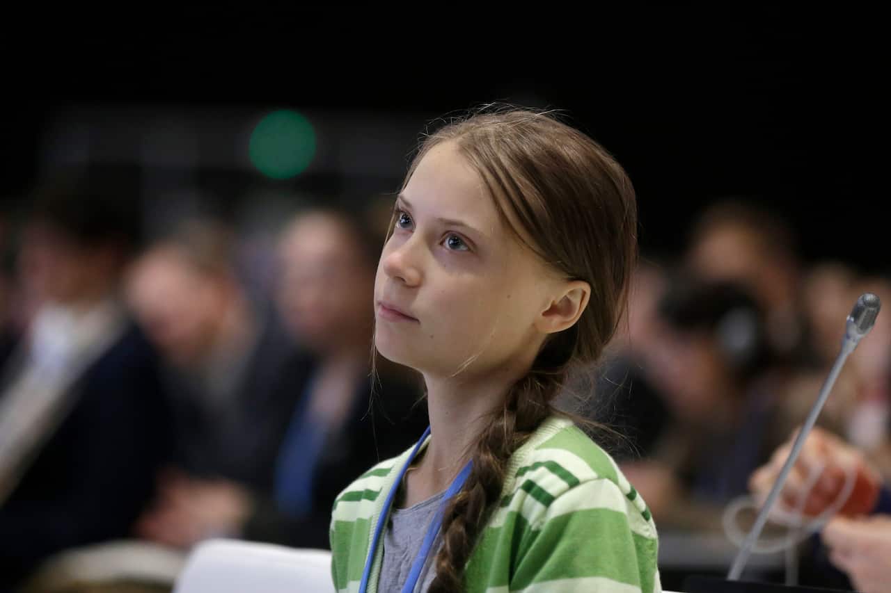 Swedish climate activist Greta Thunberg listens to speeches before addressing the conference.