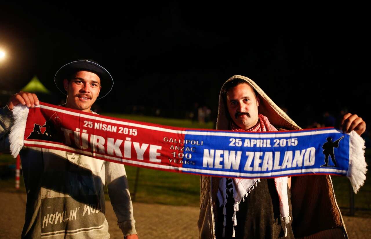 People wait for the Dawn Service ceremony at the Anzac Cove beach, the site of World War I landing of the ANZACs 