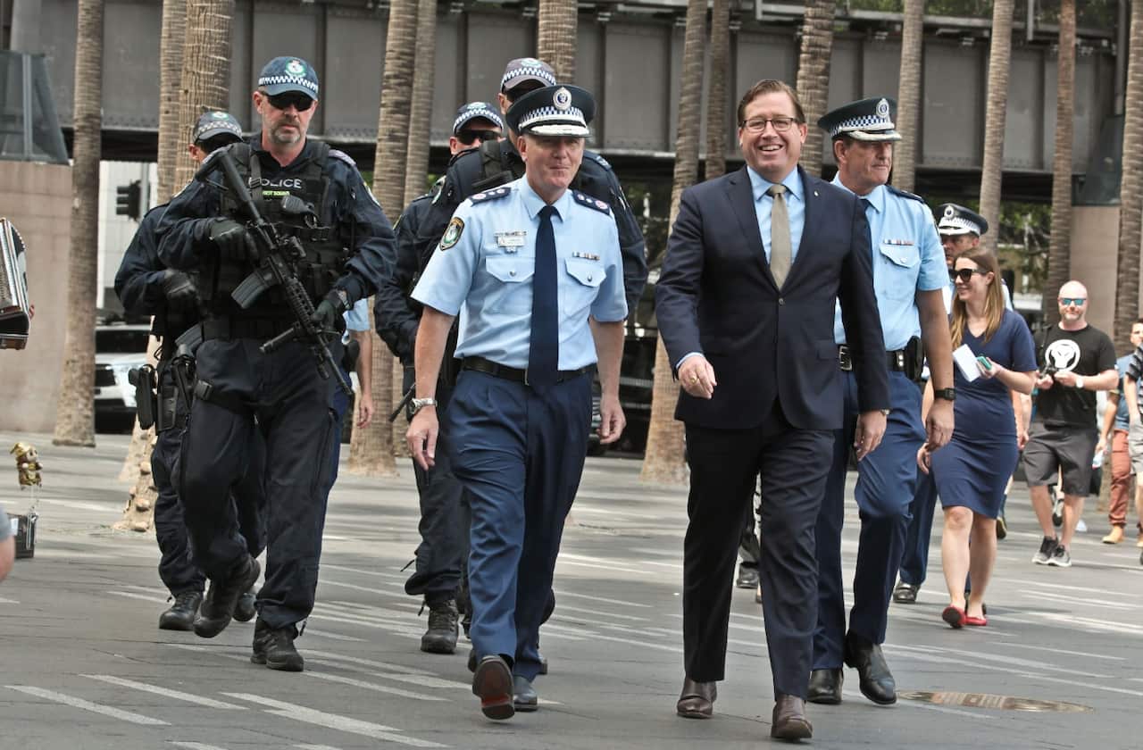 NSW Police Commissioner Mick Fuller and Police Minister Troy Grant (right) arrive to a media conference 