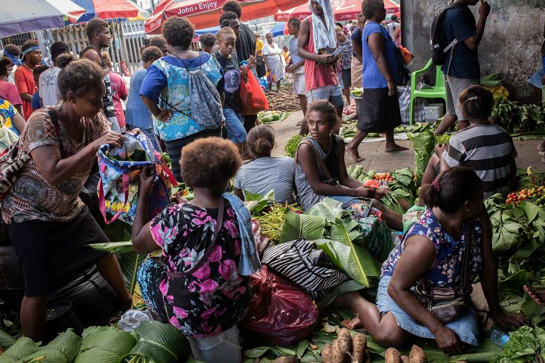 Islanders sell vegetables and foods at the central market in Honiara, the capital, on the island of Guadalcanal, Solomon Islands.
