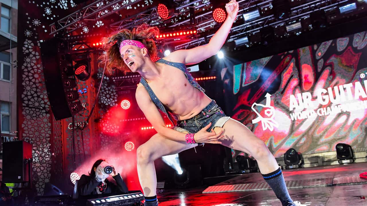Zachary Knowles alias Ichabod Fame of Canada performs during the final of the 24th Air Guitar World Championship.