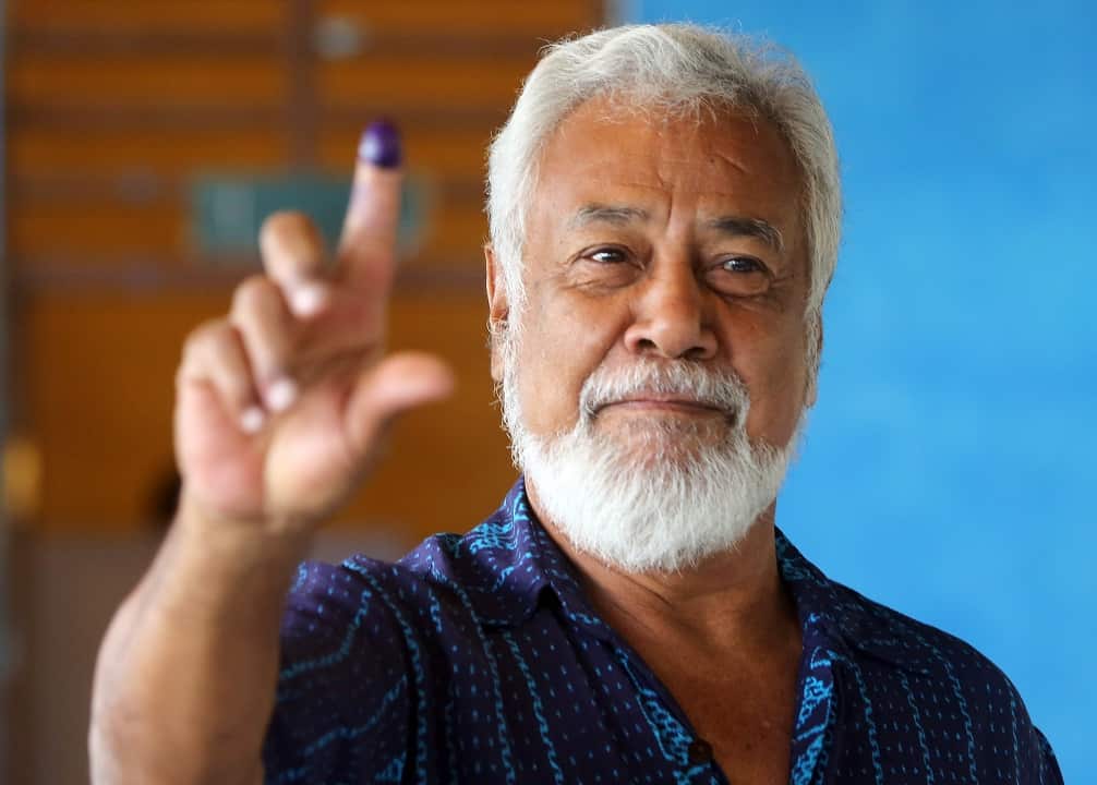 Former president and leader of the the National Congress for Timorese Reconstruction (CNRT) Xanana Gusmao shows his inked finger.