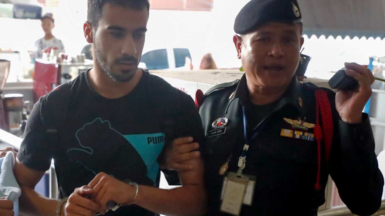 Hakeem Al-Araibi is escorted into the Criminal Court by authorities in Bangkok, Thailand, 11 December 2018. 