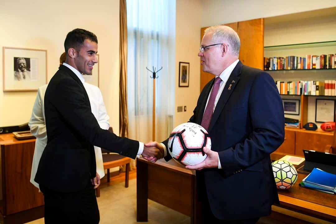 Footballer and refugee Hakeem Al-Araibi (left) is welcomed by Australian Prime Minister Scott Morrison during a meeting at Parliament House in Canberra, Thursday, February 14, 2019. (AAP Image/Lukas Coch) NO ARCHIVING
