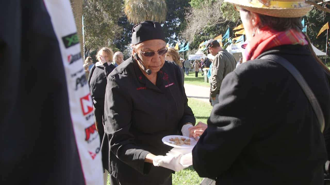 Aunty Beryl handing out food to the public at NAIDOC in the city.