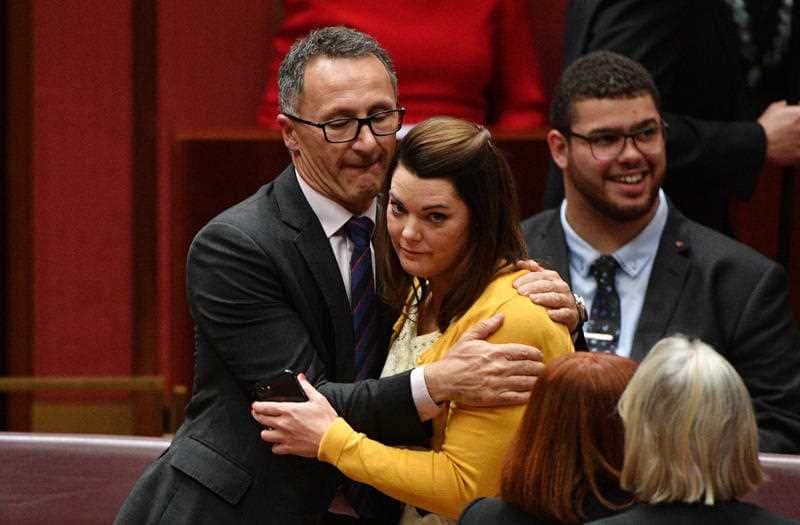 Australian Greens leader Senator Richard Di Natale (left) hugs Australian Greens Senator Sarah Hanson-Young.