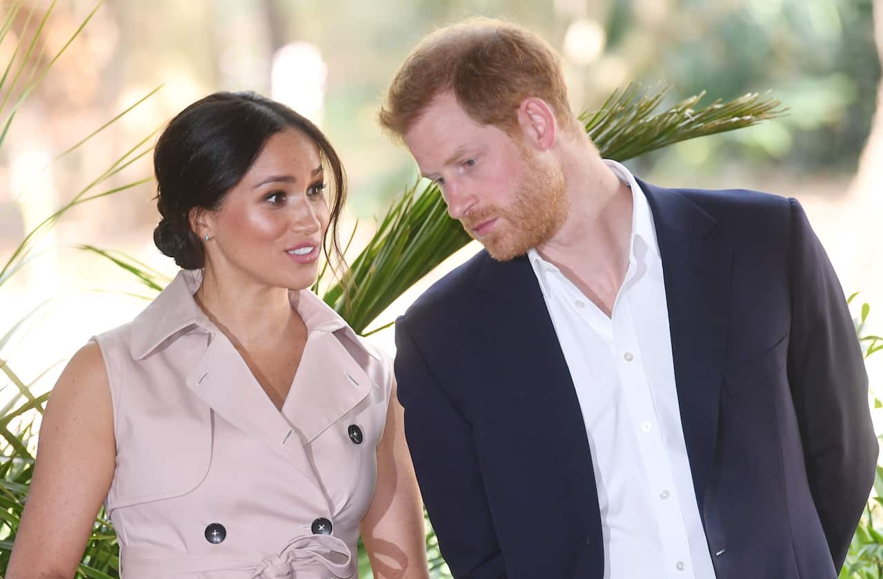 Britain's Prince Harry (R), the Duke of Sussex, and his wife Meghan (L), the Duchess of Sussex.