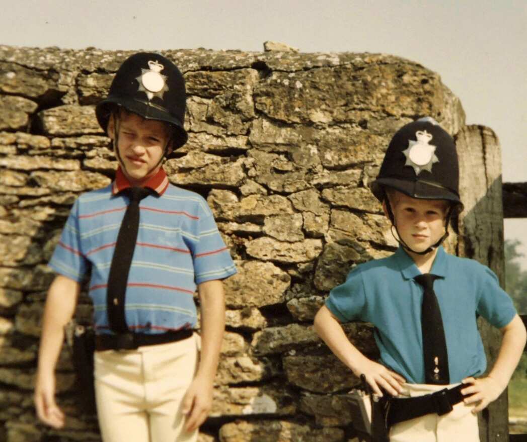 A picture from the personal photo album of the late Diana, Princess of Wales, depicting Prince William (L) and Prince Harry in borrowed policemen outfits (AAP)