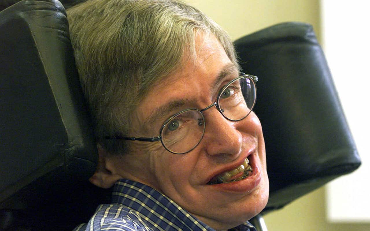 A 1999 file photo of Professor Stephen Hawking smiling during a news conference at the University of Potsdam, near Berlin.
