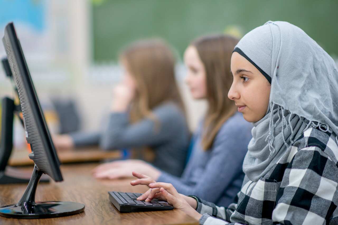 Muslim Girl Using Computer