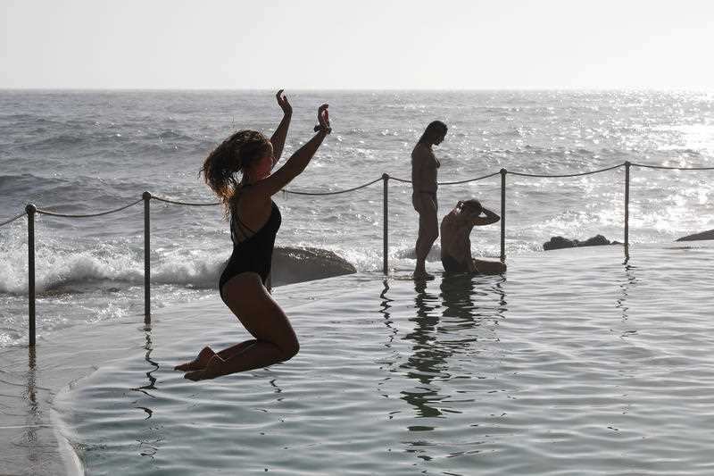 Beachgoers cool off at Bronte Beach in Sydney.