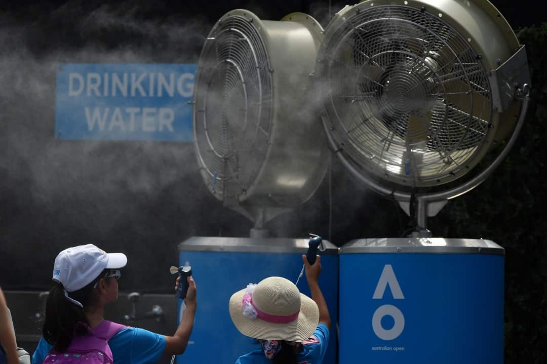 Young spectators seek relief from the baking heat at the Australian Open. 