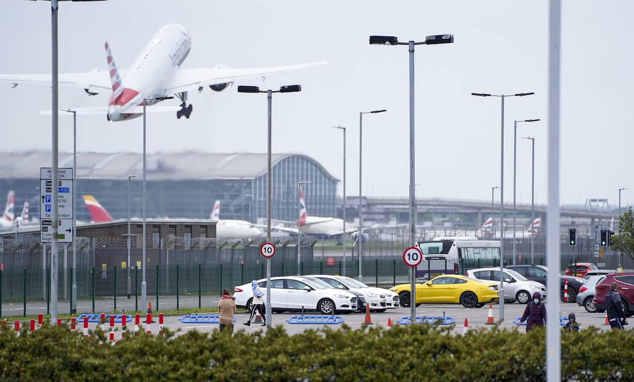 People take part in their daily exercise whilst in quarantine at the Renaissance Hotel near Heathrow Airport in London on 21 May 2021. 