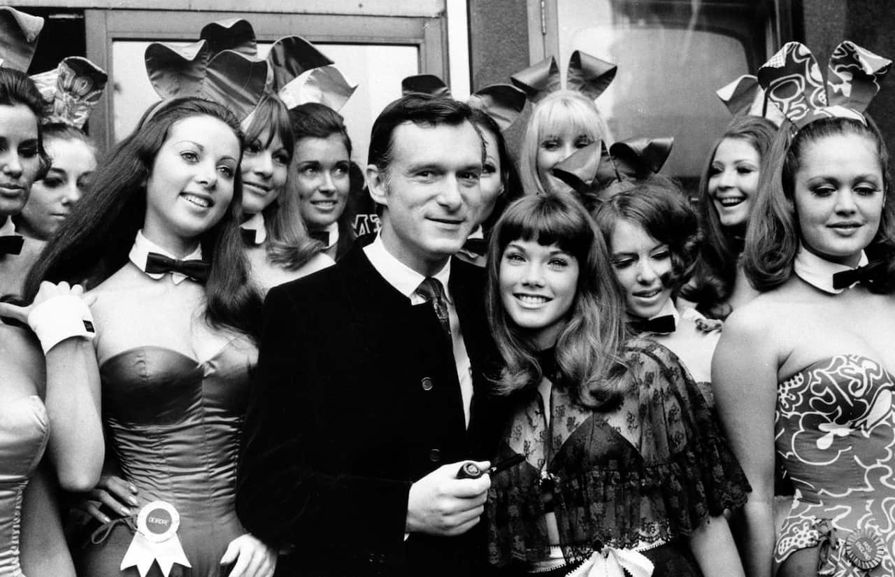 Hefner and his girlfriend Barbara Benton, 19-year-old coed turned actress, are surrounded by Bunny Gir;s in 1969 (AAP)