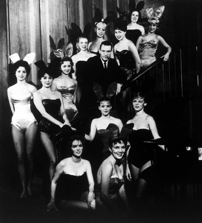 Hefner pictured amidst a group of Bunnies, at the flagship Playboy Club, in Chicago, circa 1960. (AAP)
