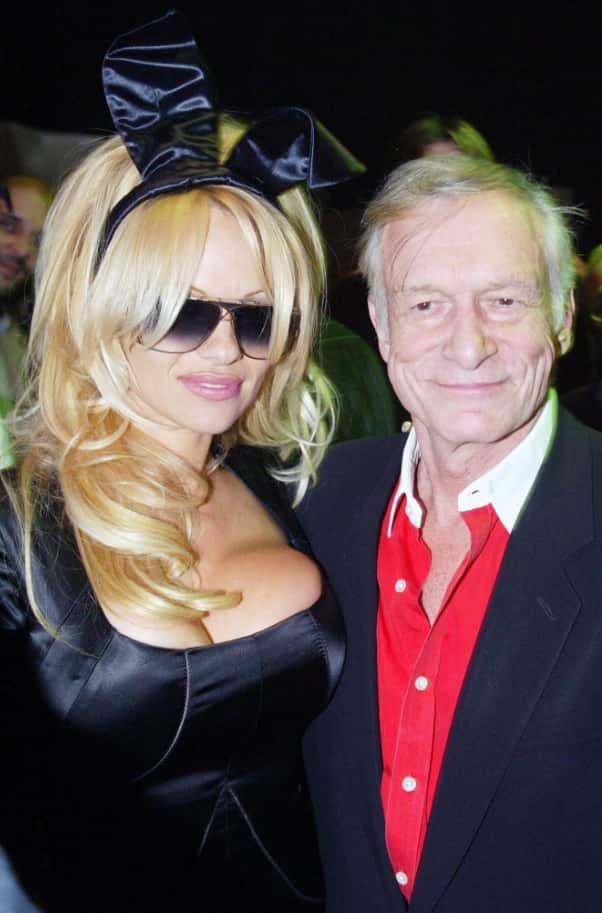 Hefner and former Playboy Playmate of the year and US Actress Pamela Anderson (L) in 2003 during the 50th anniversary of Playboy (AAP)