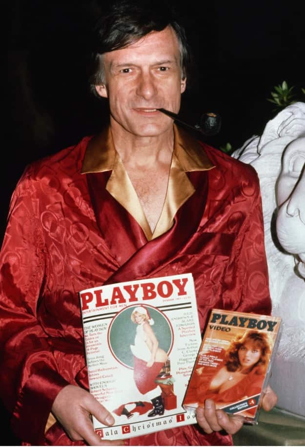 Hefner shown with a Playboy Magazine and Playboy video Nov. 11, 1982. 
