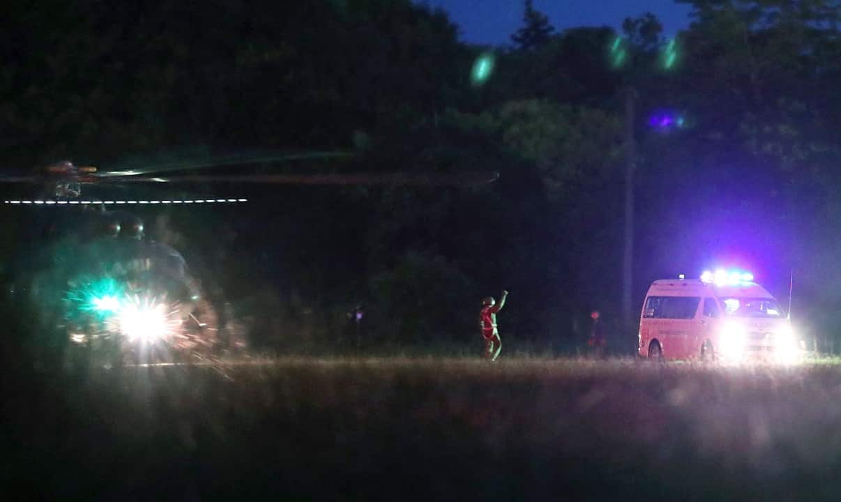 An ambulance transports the first two children after being rescued from Tham Luang cave from a helicopter before heading to hospital.