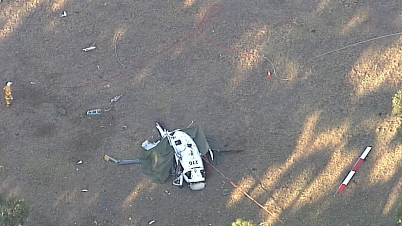 The helicopter crashed west of Ulladulla about 2pm on Friday.