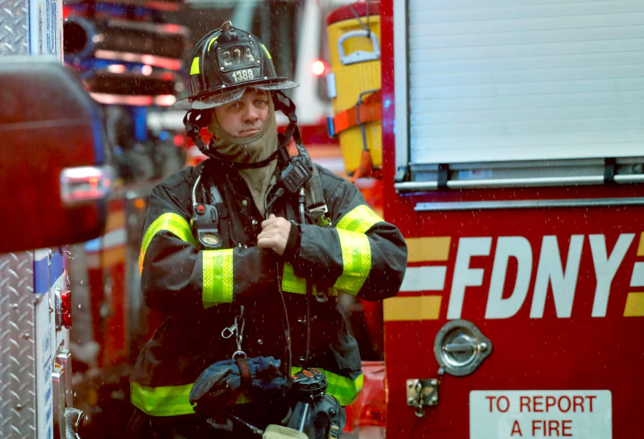 New York City firefighter at the scene near 52nd Street and 7th Ave.