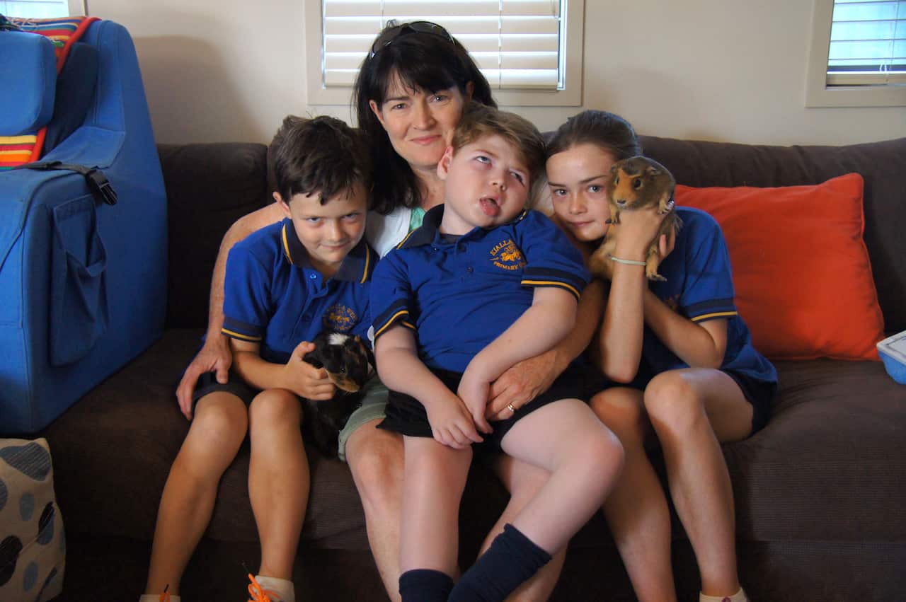 Jess Holmes with her children, Billy, Henry and Gretel.
