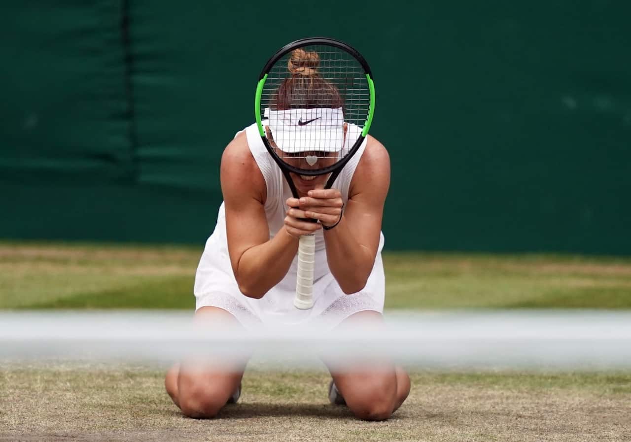 Simona Halep of Romania celebrates her victory over Serena Williams of the US in the women's final of the Wimbledon Championships