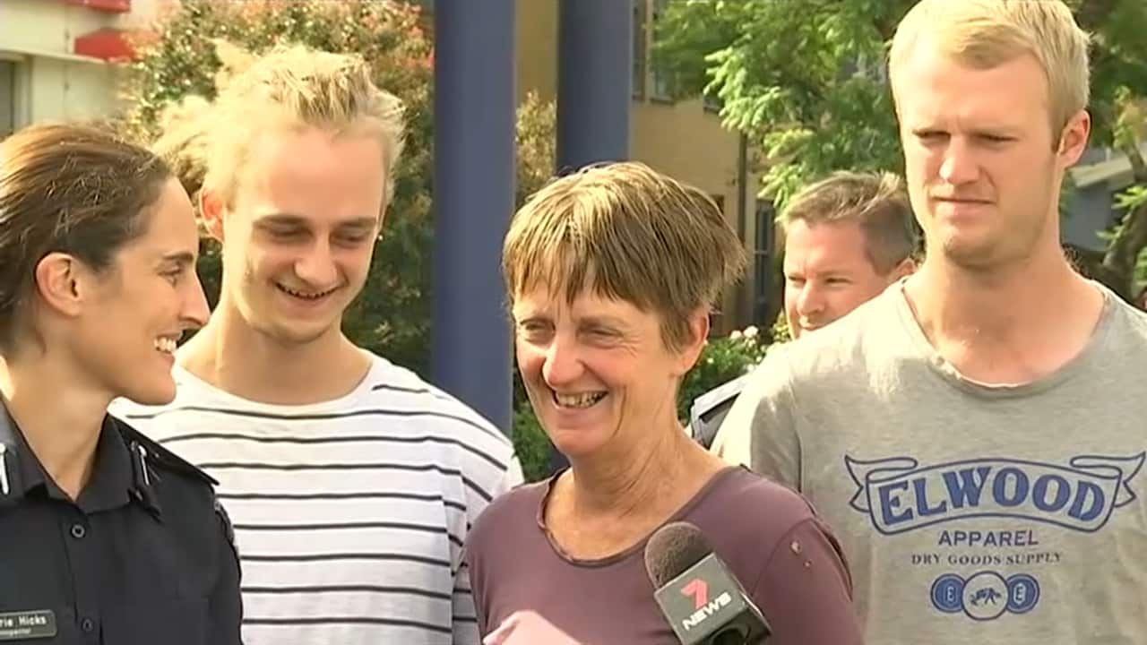 The pair speak with the media, flanked by family.