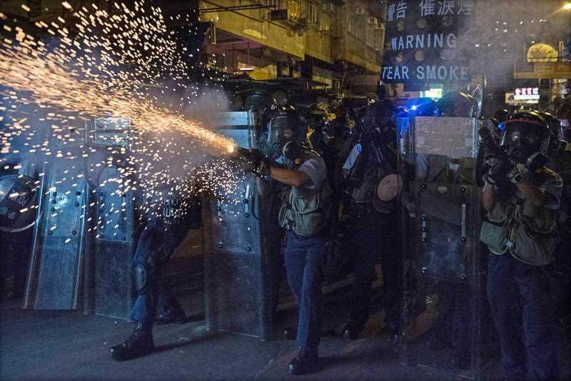 Police and protesters clash on Hong Kong's streets, complete with tear gas.