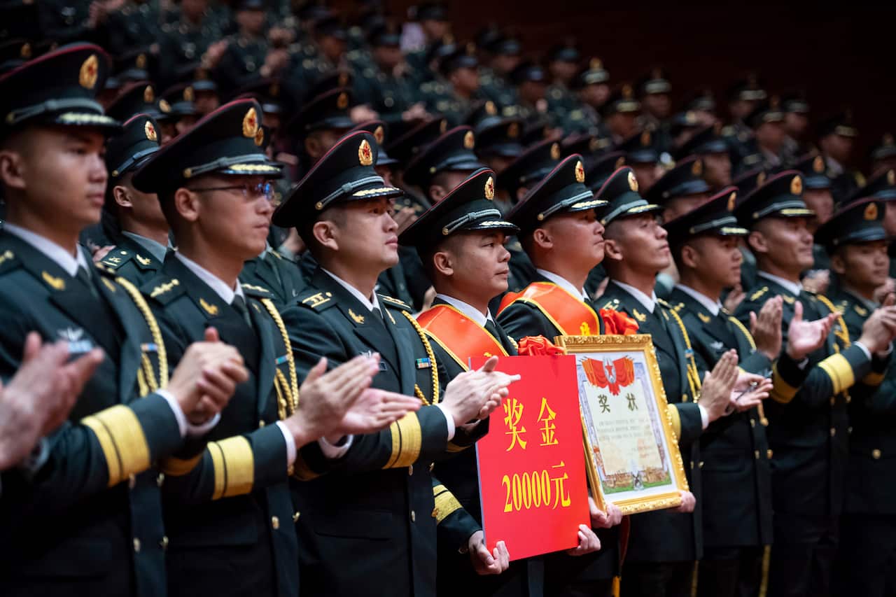 Chinese People's Liberation Army troops celebrate as part of the festivities. 