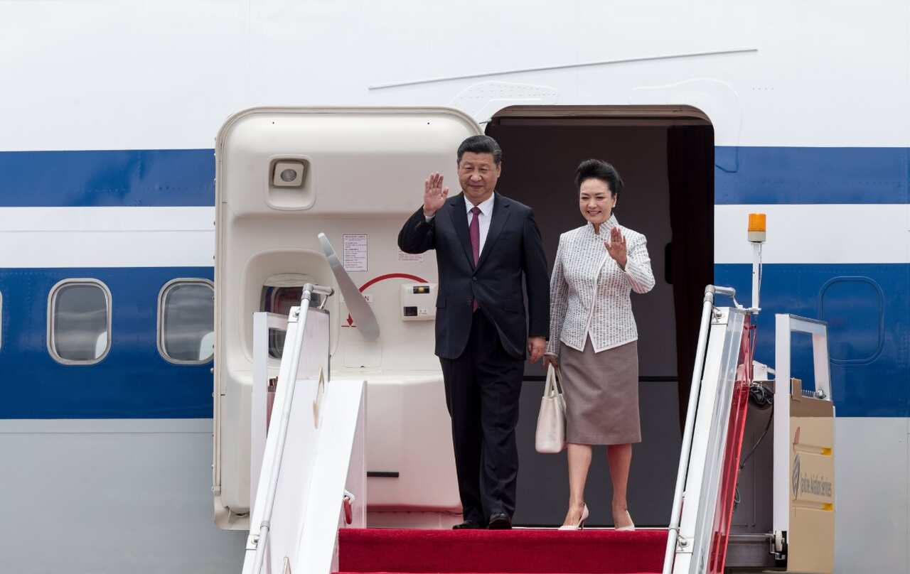 Chinese President Xi Jinping (L) and First Lady Peng Liyuan wave after landing at Hong Kong International Airport in Hong Kong, China, 29 June 2017.