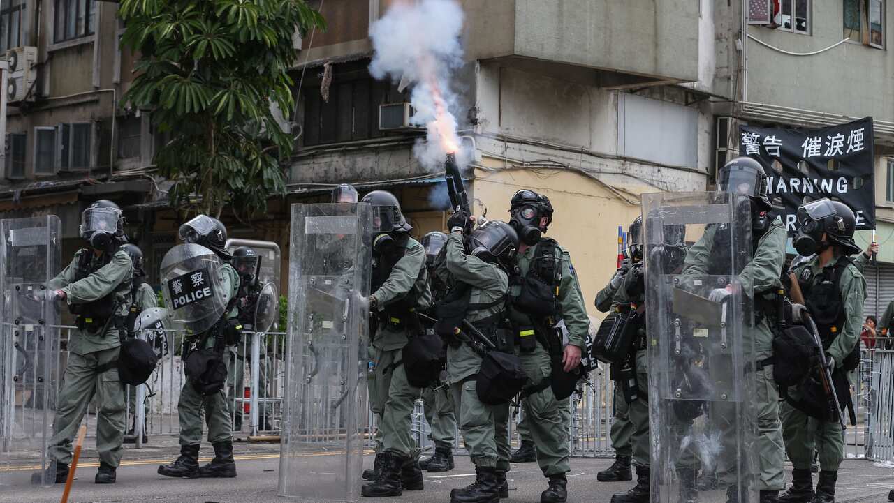 Riot police fire tear gas during a mass rally in Yuen Long, New Territories, Hong Kong, China.