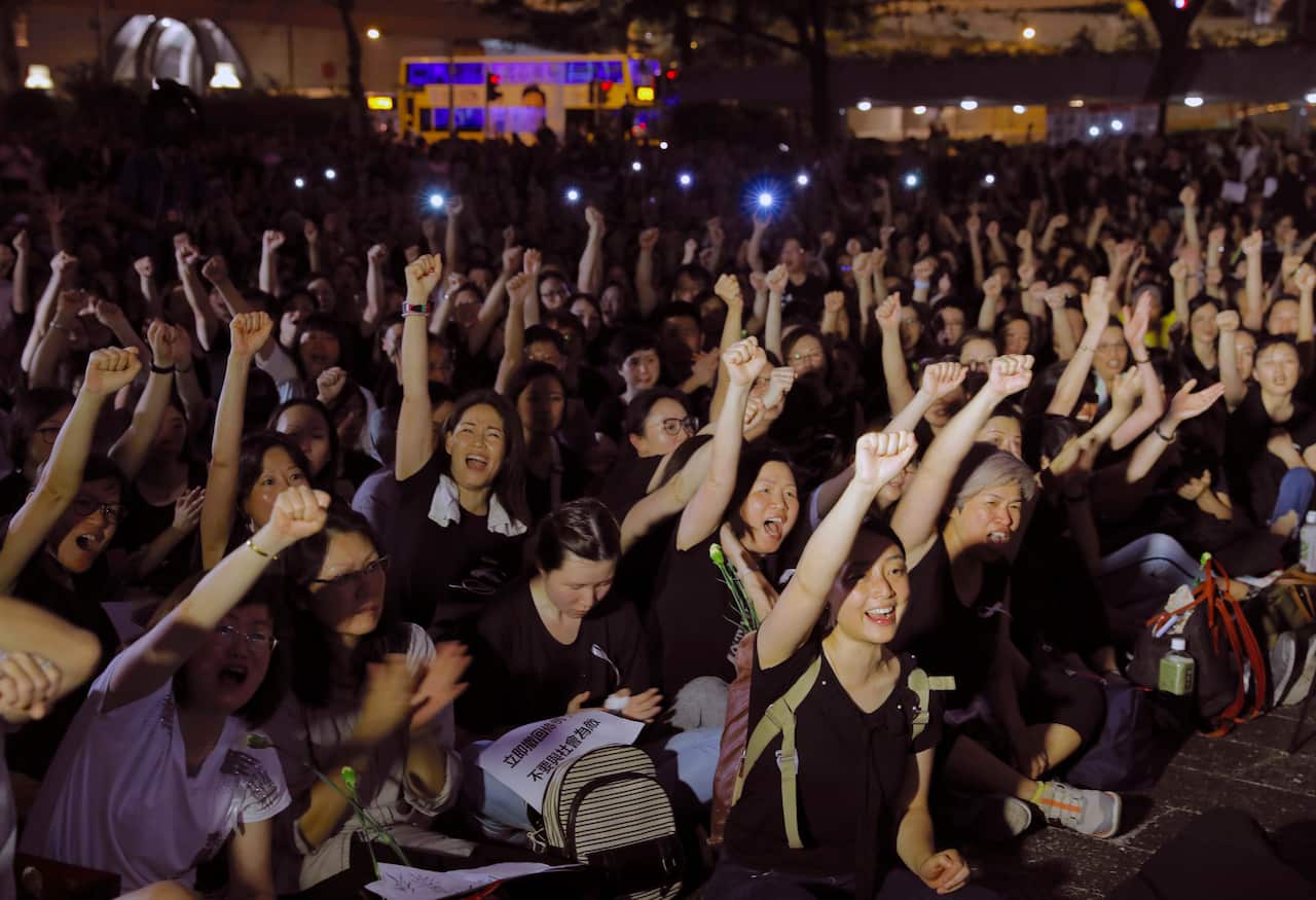 Hundreds of mothers protest against the extradition law in Hong Kong on Friday. More protests are expected today. 