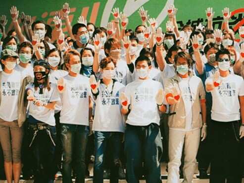 Staff at the Princess Margaret Hospital show hearts on their hands as Hong Kong overcomes SARS 