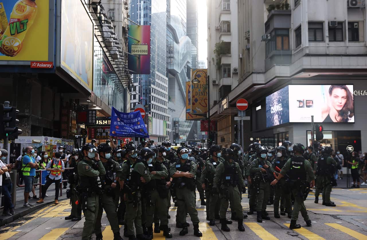 Police officers stand guard during a banned rally on China's National Day in Hong Kong.