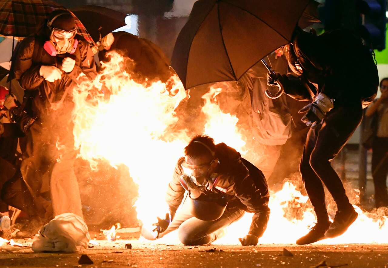 Clashes between protesters and police continue near the Hong Kong Polytechnic University in Kowloon district.
