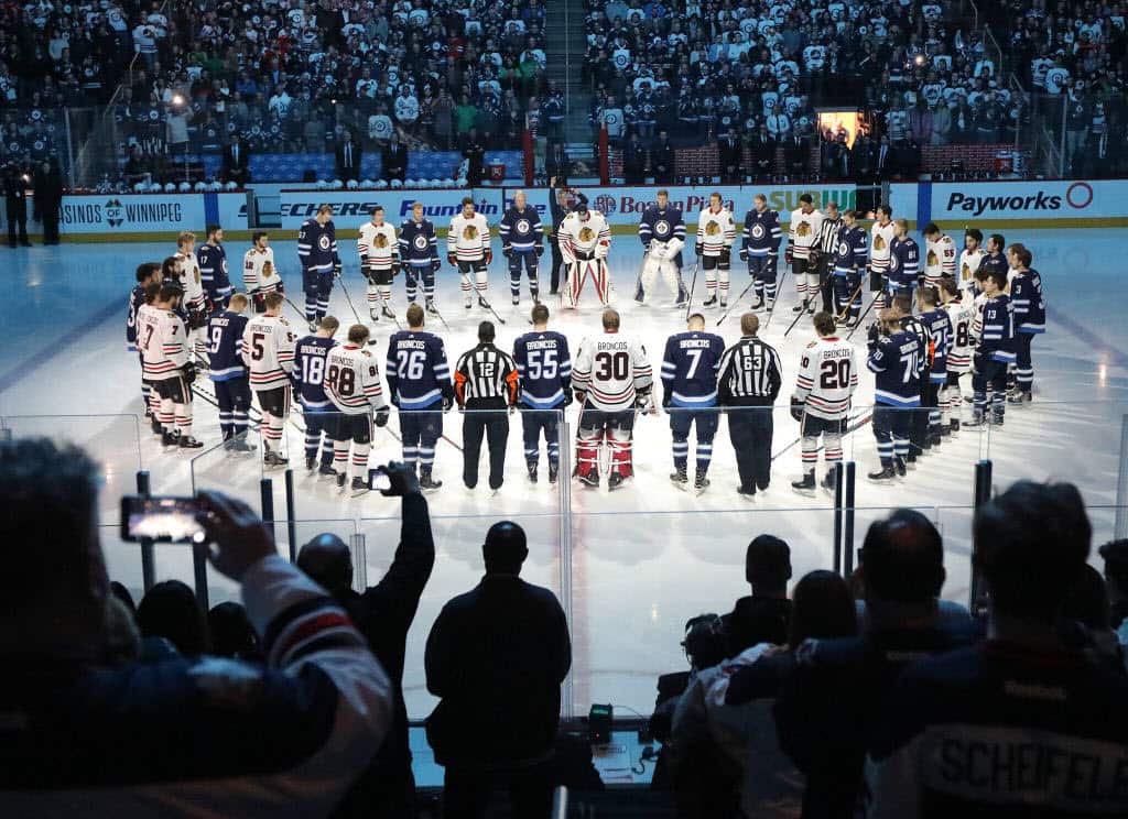 Winnipeg Jets and Chicago Blackhawks players honour those involved in the Humboldt Broncos bus crash tragedy before NHL action on April 7, 2018.
