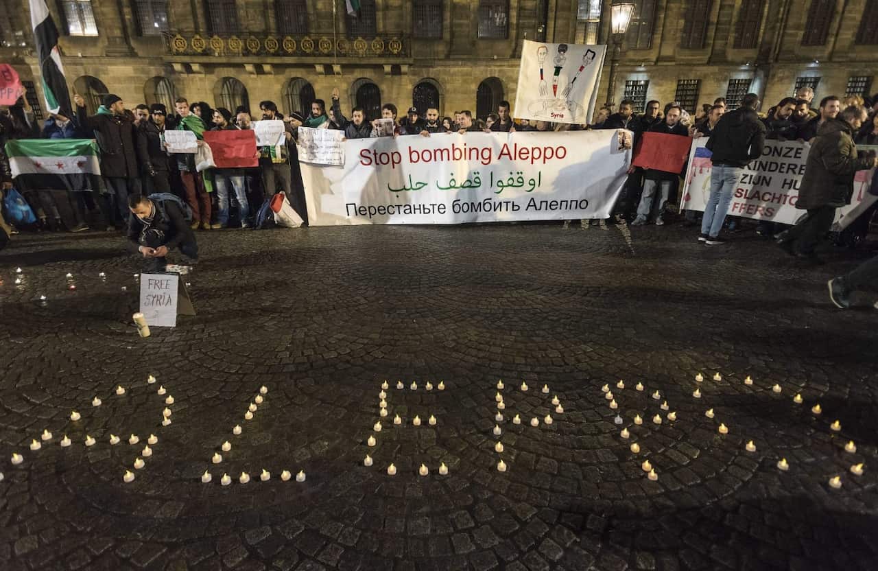  A candlelight vigil for the victims of the fighting in Aleppo is held in Dam Square in Amsterdam, The Netherlands, 14 December 2016. 