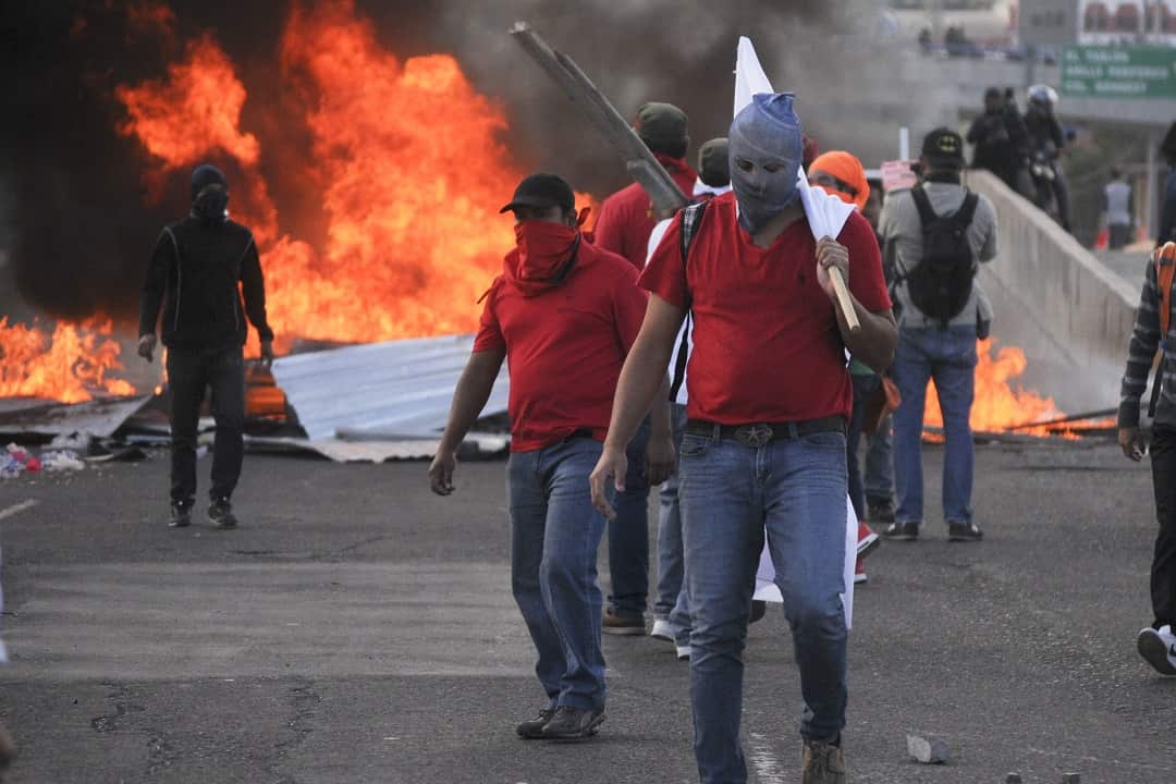 Protesters take to the streets of Honduras over alleged electoral fraud following the re-election of Juan Orlando Hernandez.