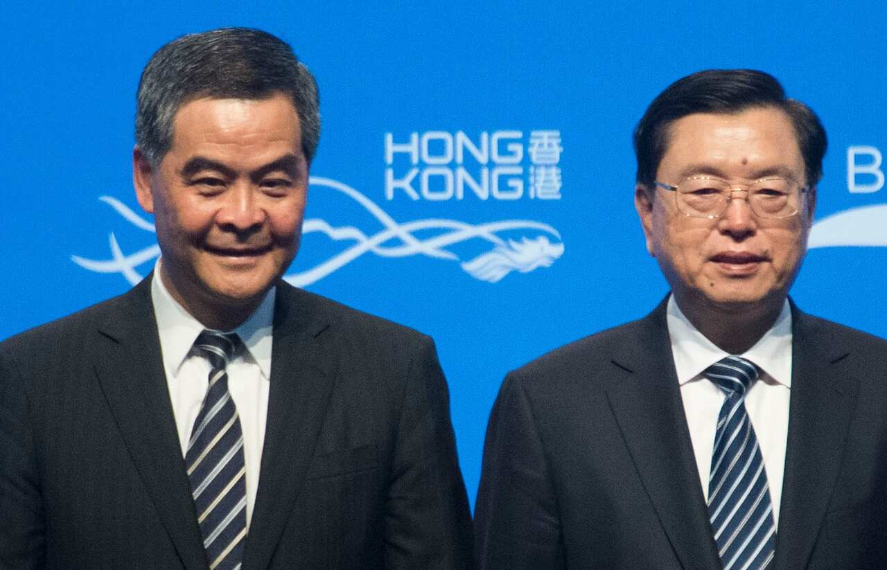 Hong Kong Chief Executive Leung Chun-ying (L) stands with Zhang Dejiang (R), who chairs China's communist-controlled legislature (Getty)