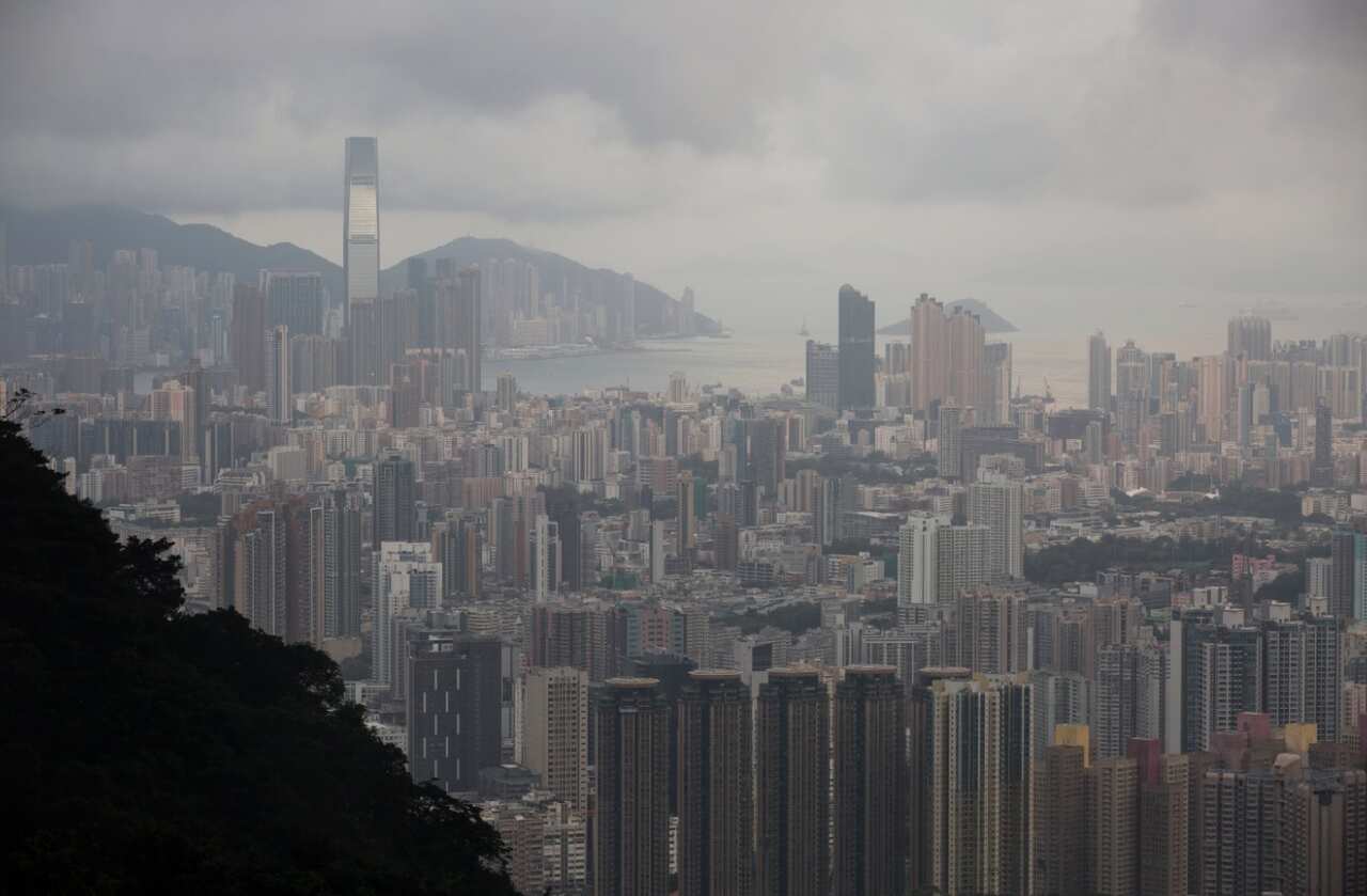 Day breaks over the Kowloon Peninsula (front) and Hong Kong island (back) in Hong Kong, China, 27 June 2017. 