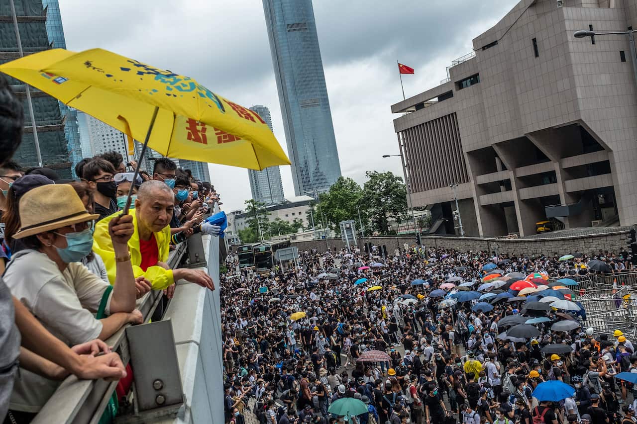 Protesters gather outside the Legislative Council in Hong Kong. 