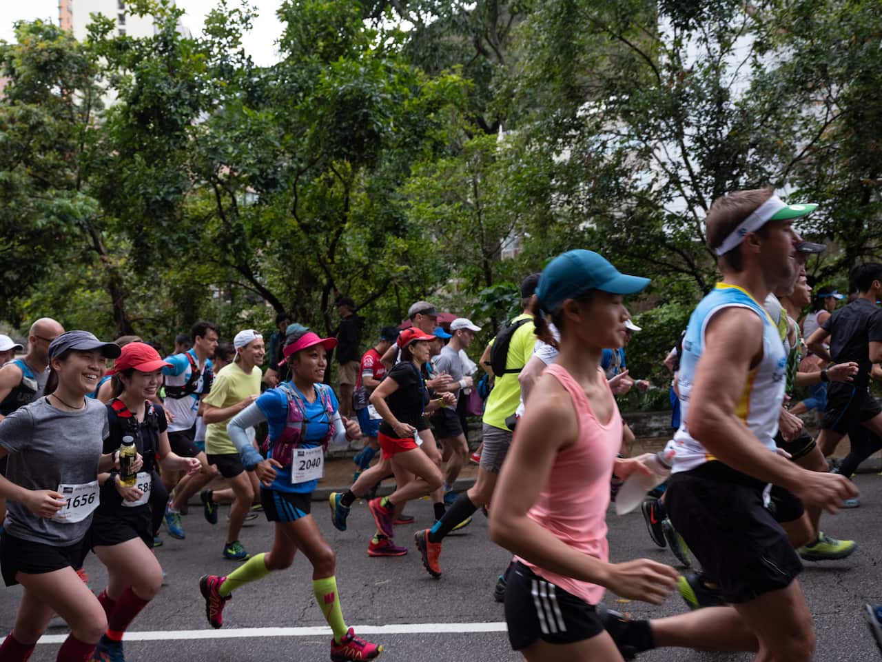 Jaybie Pagirigan, in blue, runs at the King of The Hills race in Hong Kong,