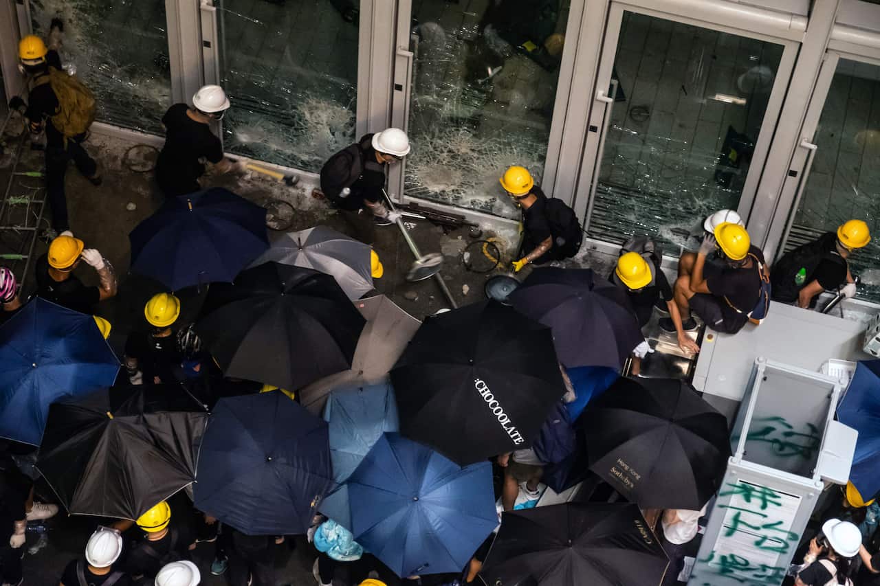 Protesters breach the doors of the Legislative Council in Hong Kong on Monday, July 1, 2019, hours after the government held a ceremony commemorating the 22nd anniversary of the territorys return to China from Britain. 